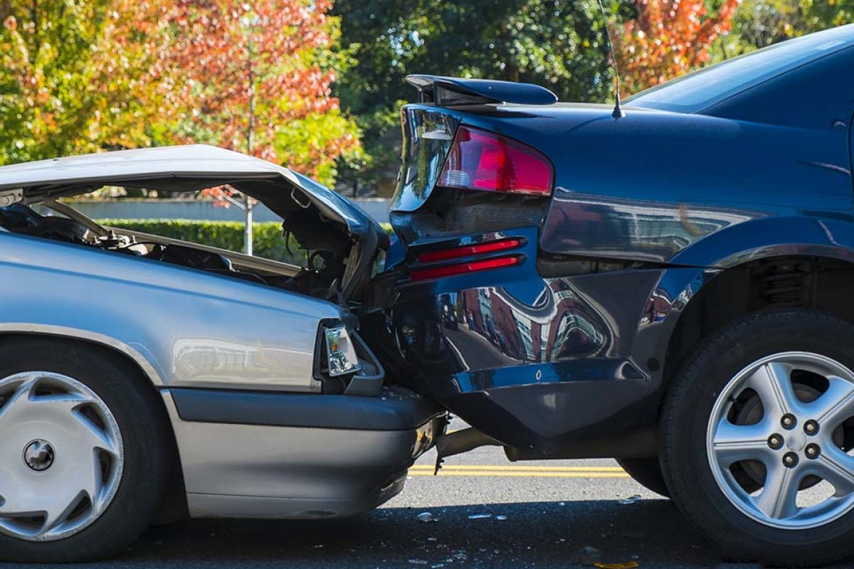 Auto accident involving two cars on a city street